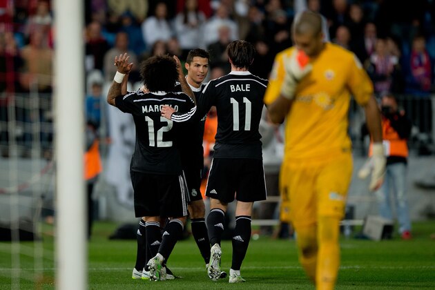 ALMERIA, SPAIN - DECEMBER 12:  Cristiano Ronaldo (3dR) of Real Madrid CF celebrates scoring their fourth goal with teammates Marcelo (L), Daniel Carvajal (2ndL) and Gareth Bale (2ndR) as goalkeeper Ruben Martinez of Almeria UD reacts defeated  during the La Liga match between UD Almeria and Real Madrid CF at Juegos del Mediterraneo stadium on December 12, 2014 in Almeria, Spain.  (Photo by Gonzalo Arroyo Moreno/Getty Images)