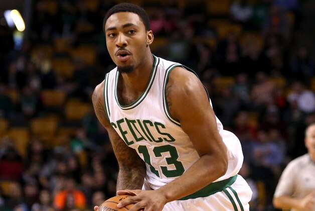 BOSTON, MA - OCTOBER 22: James Young #13 of the Boston Celtics handles the ball against the Brooklyn Nets during a preseason game at TD Garden on October 22, 2014 in Boston, Massachusetts. NOTE TO USER: User expressly acknowledges and agrees that, by downloading and or using this photograph, User is consenting to the terms and conditions of the Getty Images License Agreement.  (Photo by Mike Lawrie/Getty Images)