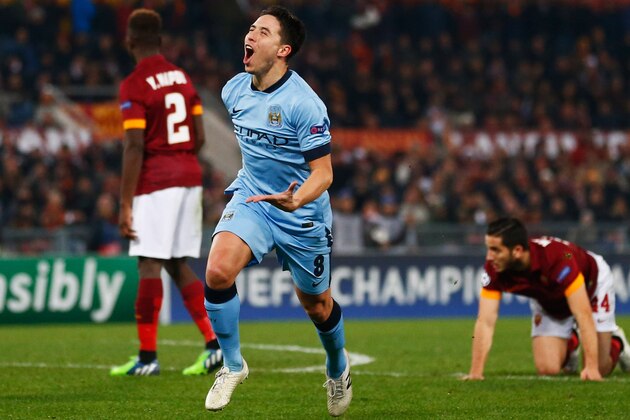 ROME, ITALY - DECEMBER 10:  Samir Nasri of Manchester City celebrates as he scores their first goal during the UEFA Champions League Group E match between AS Roma and Manchester City FC at Stadio Olimpico on December 10, 2014 in Rome, Italy.  (Photo by Julian Finney/Getty Images)