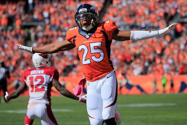 DENVER, CO - OCTOBER 05:  Cornerback Chris Harris #25 of the Denver Broncos celebrates after breaking up a pass intended for wide receiver John Brown #12 of the Arizona Cardinals at Sports Authority Field at Mile High on October 5, 2014 in Denver, Colorado. The Broncos defeated the Cardinals 41-20.  (Photo by Doug Pensinger/Getty Images)