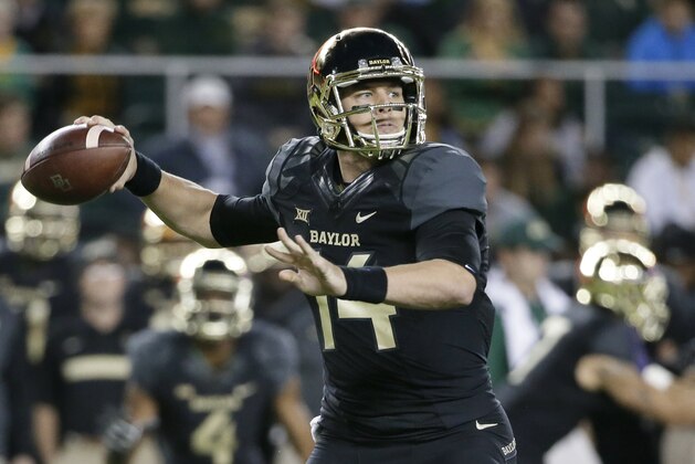 Baylor quarterback Bryce Petty (14) passes in the first half of an NCAA college football game against Kansas State, Saturday, Dec. 6, 2014, in Waco, Texas. (AP Photo/Tony Gutierrez)