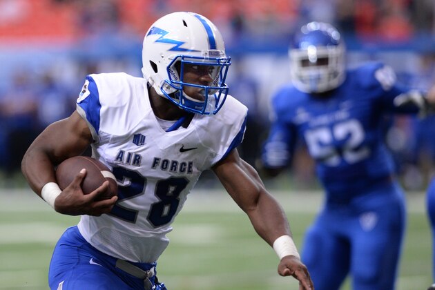 Air Force's Jacobi Owens carries the football for a first down during the first half of an NCAA college football game in Atlanta, Saturday, Sept. 13. 2014. (AP Photo/Johnny Crawford)