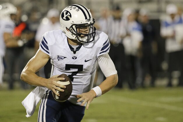 Brigham Young quarterback Christian Stewart looks for a receiver during the first half of an NCAA college football game against Central Florida in Orlando, Fla., Thursday, Oct. 9, 2014. (AP Photo/John Raoux)