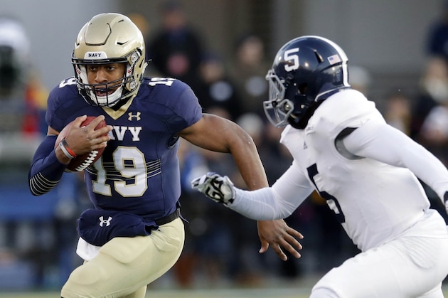 Navy quarterback Keenan Reynolds, left, rushes the ball around Georgia Southern cornerback Darius Jones in the first half of an NCAA college football game, Saturday, Nov. 15, 2014, in Annapolis, Md. (AP Photo/Patrick Semansky)