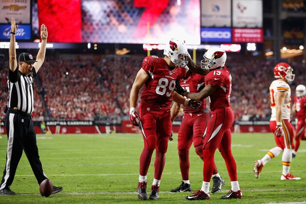 GLENDALE, AZ - DECEMBER 07:  Tight end John Carlson #89 of the Arizona Cardinals celebrates a two-point conversion with wide receiver Ted Ginn #19 and wide receiver Larry Fitzgerald #11 during the third quarter of the NFL game against the Kansas City Chiefs at the University of Phoenix Stadium on December 7, 2014 in Glendale, Arizona.  (Photo by Christian Petersen/Getty Images)