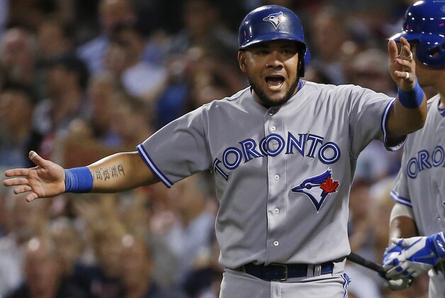 Toronto Blue Jays' Melky Cabrera argues after he was called out trying to score on a single by Dioner Navarro during the sixth inning of a baseball game against the Boston Red Sox at Fenway Park in Boston, Wednesday, July 30, 2014. (AP Photo/Elise Amendola)