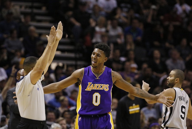 Dec 12, 2014; San Antonio, TX, USA; Los Angeles Lakers small forward Nick Young (0) reacts after a shot against the San Antonio Spurs during the first half at AT&T Center. Mandatory Credit: Soobum Im-USA TODAY Sports
