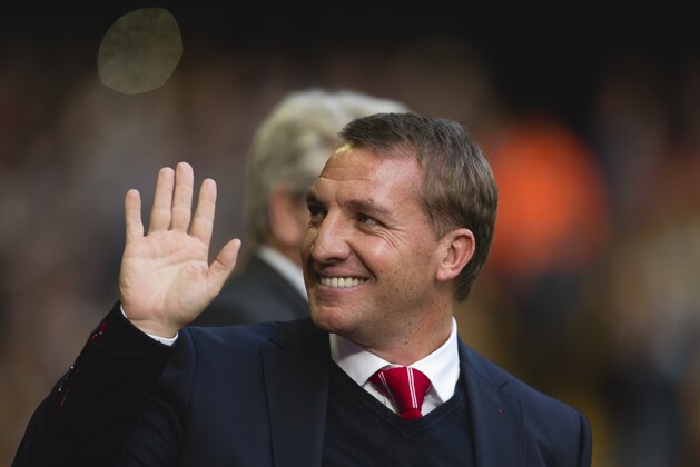 Liverpool's manager Brendan Rodgers waves as he takes to the touchline before his team's English Premier League soccer match against Hull at Anfield Stadium, Liverpool, England, Saturday Oct. 25, 2014. (AP Photo/Jon Super)