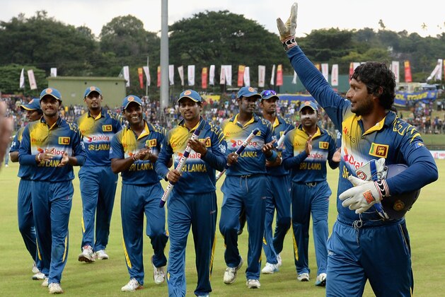 KANDY, SRI LANKA - DECEMBER 13:  Kumar Sangakkara of Sri Lanka leaves the field after winning the 6th One Day International match between Sri Lanka and England at Pallekele Cricket Stadium on December 13, 2014 in Kandy, Sri Lanka.  (Photo by Gareth Copley/Getty Images)