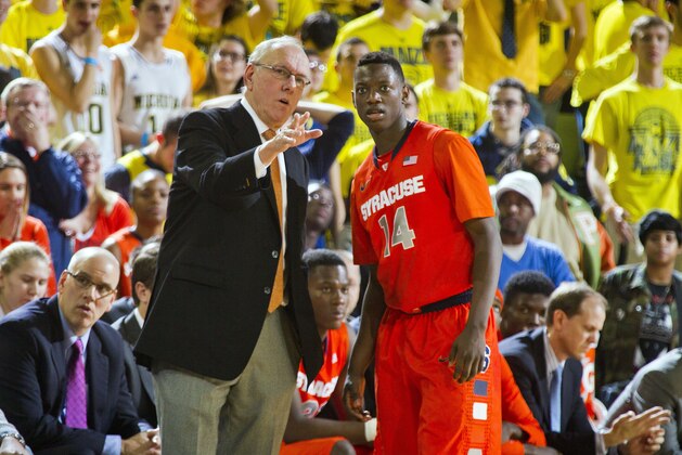 Syracuse head coach Jim Boeheim, left, gives instruction to Syracuse guard Kaleb Joseph (14) in the second half of an NCAA college basketball game against Michigan at Crisler Center in Ann Arbor, Mich., Tuesday, Dec. 2, 2014. Michigan won 68-65. (AP Photo/Tony Ding) Syracuse head coach Jim Boeheim, left, gives instruction to Syracuse guard Kaleb Joseph (14) in the second half of an NCAA college basketball game against Michigan at Crisler Center in Ann Arbor, Mich., Tuesday, Dec. 2, 2014. Michigan won 68-65. (AP Photo/Tony Ding)