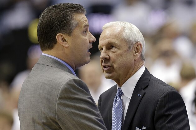 Kentucky coach John Calipari, left, and North Carolina coach Roy Williams speak before an NCAA college basketball game in Chapel Hill, N.C., Saturday, Dec. 14, 2013. (AP Photo/Gerry Broome)