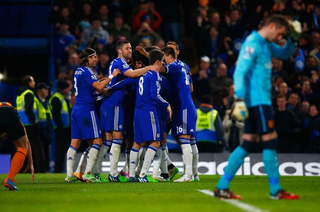 LONDON, ENGLAND - DECEMBER 13:  Diego Costa of Chelsea (C) celebrates with team mates as he scores their second goal during the Barclays Premier League match between Chelsea and Hull City at Stamford Bridge on December 13, 2014 in London, England.  (Photo by Clive Rose/Getty Images)