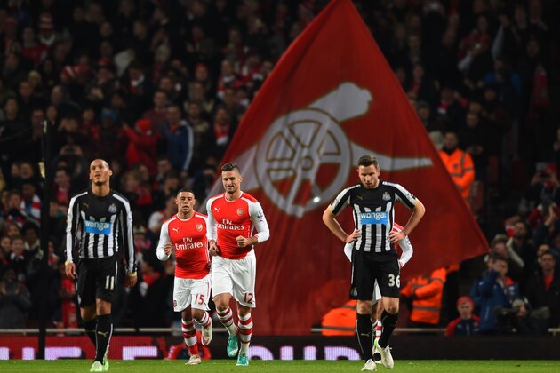 LONDON, ENGLAND - DECEMBER 13:  Olivier Giroud of Arsenal celebrates scoring his goal during the Barclays Premier League match between Arsenal and Newcastle United at Emirates Stadium on December 13, 2014 in London, England.  (Photo by Paul Gilham/Getty Images)