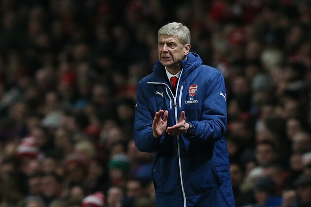 Arsenal’s manager Arsene Wenger looks across the pitch during the English Premier League soccer match between Arsenal and Newcastle United at the Emirates Stadium, London, Saturday, Dec. 13, 2014. (AP Photo/Tim Ireland)