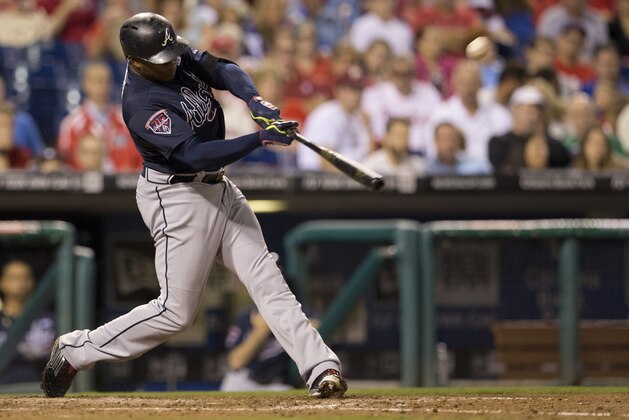 PHILADELPHIA, PA - SEPTEMBER 27: Left fielder Justin Upton #8 of the Atlanta Braves hits a two run home run in the top of the seventh inning against the Philadelphia Phillies on September 27, 2014 at Citizens Bank Park in Philadelphia, Pennsylvania. The Braves defeated the Phillies 4-2. (Photo by Mitchell Leff/Getty Images)