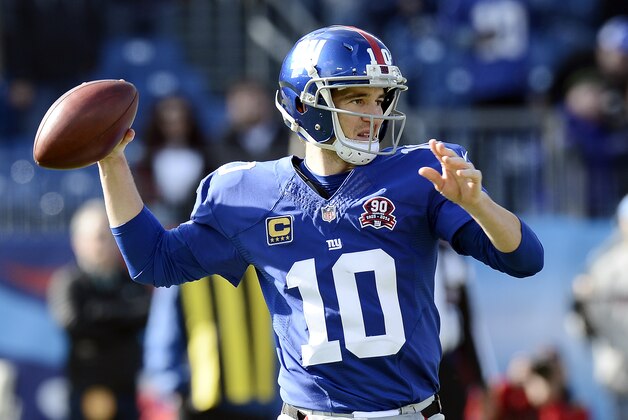 New York Giants quarterback Eli Manning passes against the Tennessee Titans in the first half of an NFL football game Sunday, Dec. 7, 2014, in Nashville, Tenn. (AP Photo/Mark Zaleski)
