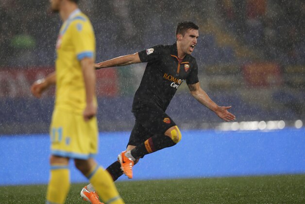 AS Roma midfielder Kevin Strootman celebrates after scoring  during an Italian Cup, semifinal first leg match, between AS Roma and Napoli at Rome's Olympic stadium, Wednesday, Feb. 5, 2014. (AP Photo/Alessandra Tarantino)