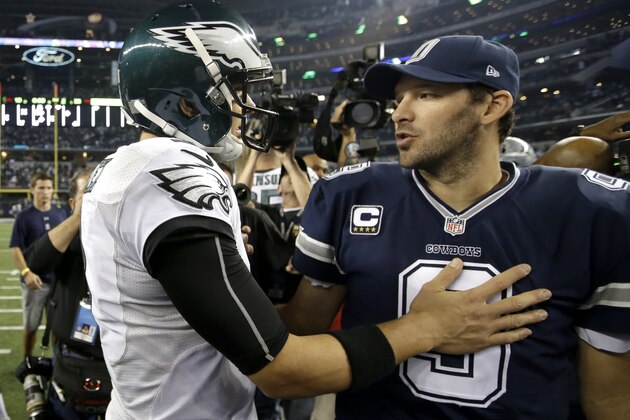 FILE - In this Nov. 27, 2014, file photo, Philadelphia Eagles' Mark Sanchez, left, greets Dallas Cowboys' Tony Romo after the Eagles 33-10 win in an NFL football game in Arlington, Texas. Just 17 days after the Eagles dominated the Cowboys, Romo and Co. get another shot at Philadelphia with first place in the NFC East at stake. (AP Photo/Tim Sharp, File)
