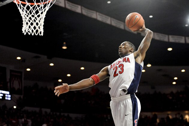 Dec 13, 2014; Tucson, AZ, USA; Arizona Wildcats forward Rondae Hollis-Jefferson (23) dunks the ball against the Michigan Wolverines during the second half at McKale Center. Arizona won 80-53. Mandatory Credit: Casey Sapio-USA TODAY Sports