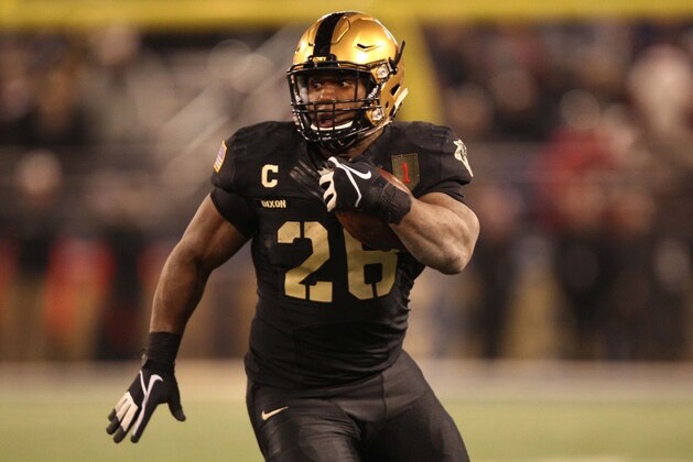 Dec 13, 2014; Baltimore, MD, USA; Army Black Knights fullback Larry Dixon (26) runs after a catch during the second half against the Navy Midshipmen at M&T Bank Stadium. Mandatory Credit: Danny Wild-USA TODAY Sports