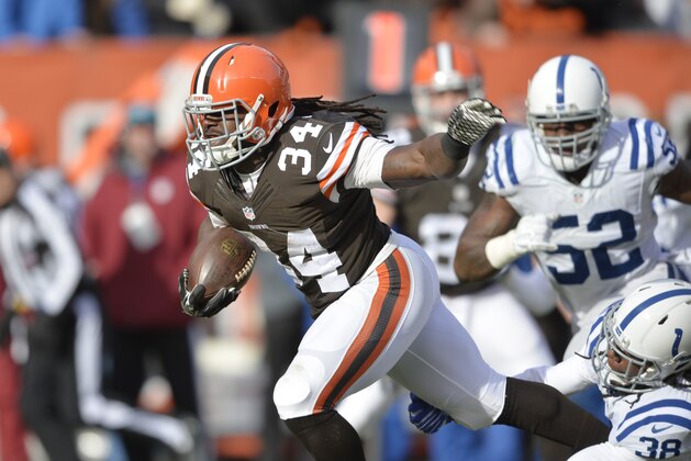 Cleveland Browns running back Isaiah Crowell (34) runs for s first down against the Indianapolis Colts in the first quarter of an NFL football game Sunday, Dec. 7, 2014, in Cleveland. (AP Photo/David Richard)