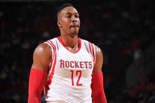 HOUSTON, TX - DECEMBER 13:  Dwight Howard #12 of the Houston Rockets during the game against the Denver Nuggets on December 13, 2014 at the Toyota Center in Houston, Texas. NOTE TO USER: User expressly acknowledges and agrees that, by downloading and or using this photograph, User is consenting to the terms and conditions of the Getty Images License Agreement. Mandatory Copyright Notice: Copyright 2014 NBAE (Photo by Bill Baptist/NBAE via Getty Images)