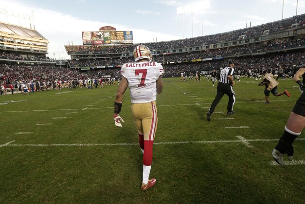 San Francisco 49ers quarterback Colin Kaepernick (7) walks off the field during the second half of an NFL football game against the Oakland Raiders in Oakland, Calif., Sunday, Dec. 7, 2014. (AP Photo/Marcio Jose Sanchez)