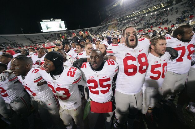Ohio State players celebrate following their 49-37 win over Michigan State in an NCAA college football game, Saturday, Nov. 8, 2014, in East Lansing, Mich. (AP Photo/Al Goldis)