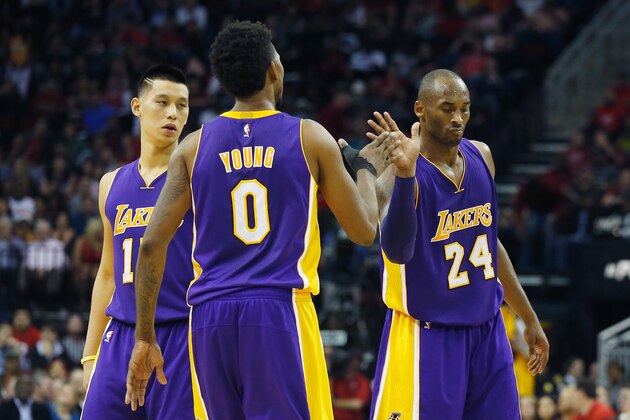 HOUSTON, TX - NOVEMBER 19:  Kobe Bryant #24 of the Los Angeles Lakers celebrates a play with Jeremy Lin #17  and Nick Young #0 during their game against the Houston Rockets at the Toyota Center on November 19, 2014 in Houston, Texas.  NOTE TO USER: User expressly acknowledges and agrees that, by downloading and/or using this photograph, user is consenting to the terms and conditions of the Getty Images License Agreement.  (Photo by Scott Halleran/Getty Images)