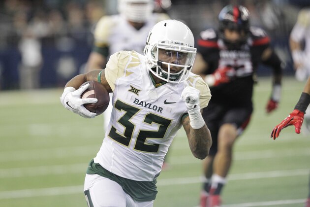 Baylor running back Shock Linwood (32) carries the ball in the first half of an NCAA college football game against Texas Tech, Saturday, Nov. 29, 2014, in Arlington, Texas. (AP Photo/Tim Sharp)