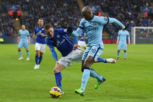LEICESTER, ENGLAND - DECEMBER 13:  Jamie Vardy of Leicester City and Eliaquim Mangala of Manchester City compete for the ball during the Barclays Premier League match between Leicester City and Manchester City at The King Power Stadium on December 13, 2014 in Leicester, England.  (Photo by Clive Mason/Getty Images)