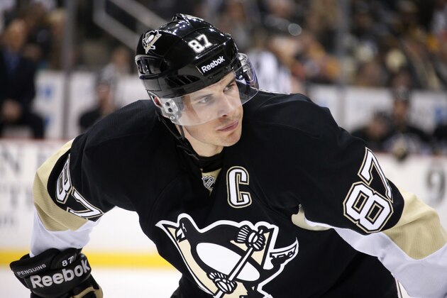 Pittsburgh Penguins center Sidney Crosby (87) prepares for a face off during the second period of an NHL hockey game against the Ottawa Senators in Pittsburgh Saturday, Dec. 6, 2014. The Penguins won 3-2. (AP Photo/Gene J. Puskar)