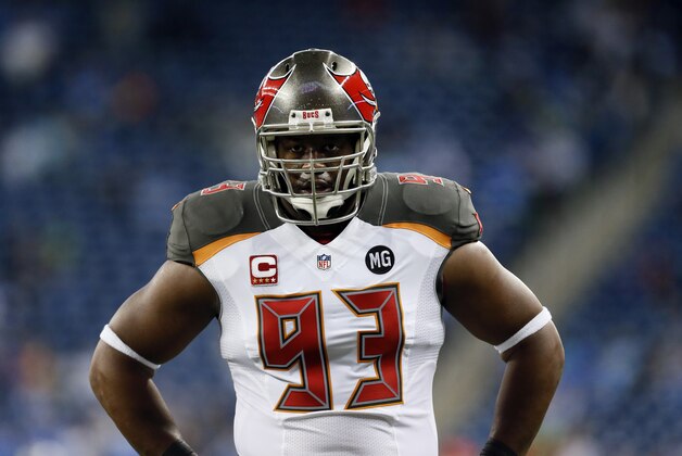 Tampa Bay Buccaneers defensive tackle Gerald McCoy watches during pre-game warmups of an NFL football game against the Detroit Lions in Detroit, Sunday, Dec. 7, 2014. (AP Photo/Paul Sancya)
