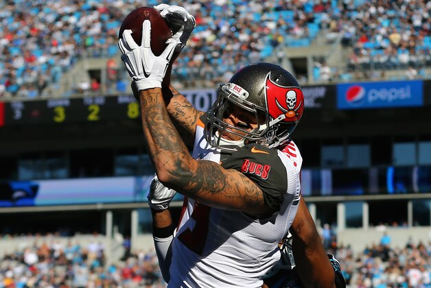 CHARLOTTE, NC - DECEMBER 14: Mike Evans #13 of the Tampa Bay Buccaneers makes a 1st quarter touchdown catch against Josh Norman #24 of the Carolina Panthers during their game at Bank of America Stadium on December 14, 2014 in Charlotte, North Carolina. (Photo by Streeter Lecka/Getty Images) CHARLOTTE, NC - DECEMBER 14: Mike Evans #13 of the Tampa Bay Buccaneers makes a 1st quarter touchdown catch against Josh Norman #24 of the Carolina Panthers during their game at Bank of America Stadium on December 14, 2014 in Charlotte, North Carolina. (Photo by Streeter Lecka/Getty Images)