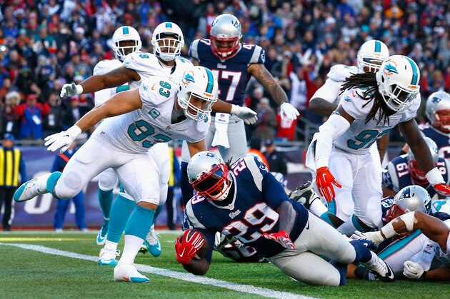 FOXBORO, MA - DECEMBER 14:  LeGarrette Blount #29 of the New England Patriots carries the ball for a touchdown during the third quarter against the Miami Dolphins at Gillette Stadium on December 14, 2014 in Foxboro, Massachusetts.  (Photo by Jared Wickerham/Getty Images)