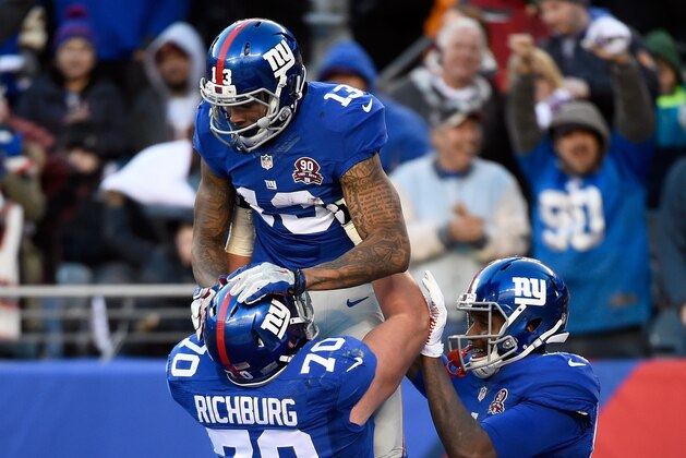 EAST RUTHERFORD, NJ - DECEMBER 14:  Odell Beckham Jr. #13 of the New York Giants celebrates with Weston Richburg #70 after scoring a 35 yard touchdown in the third quarter against the Washington Redskins during their game at MetLife Stadium on December 14, 2014 in East Rutherford, New Jersey.  (Photo by Alex Goodlett/Getty Images)