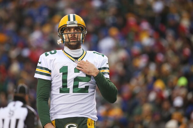 ORCHARD PARK, NY - DECEMBER 14:   Aaron Rodgers #12 of the Green Bay Packers looks at the clock against the Buffalo Bills during the second half at Ralph Wilson Stadium on December 14, 2014 in Orchard Park, New York.  (Photo by Tom Szczerbowski/Getty Images)