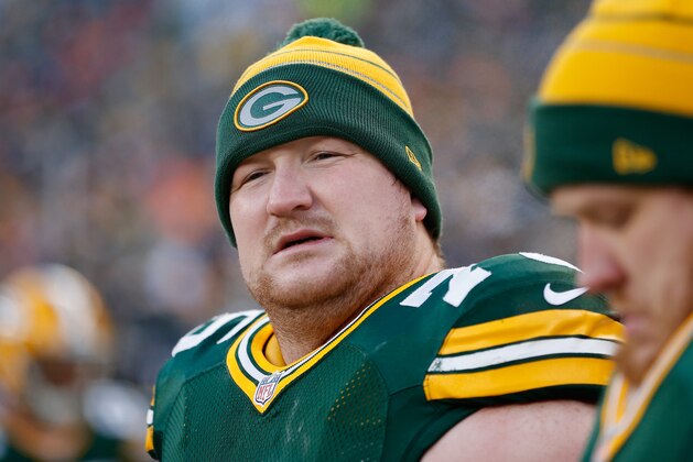 GREEN BAY, WI - NOVEMBER 30: Tackle Bryan Bulaga #75 of the Green Bay Packers on the sidelines during the NFL game against the New England Patriots at Lambeau Field on November 30, 2014 in Green Bay, Wisconsin. The Packers defeated the Patriots 26-21. (Photo by Christian Petersen/Getty Images) GREEN BAY, WI - NOVEMBER 30: Tackle Bryan Bulaga #75 of the Green Bay Packers on the sidelines during the NFL game against the New England Patriots at Lambeau Field on November 30, 2014 in Green Bay, Wisconsin. The Packers defeated the Patriots 26-21. (Photo by Christian Petersen/Getty Images)