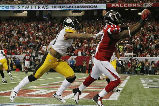 Atlanta Falcons wide receiver Devin Hester (17) prepares to make a touch-down catch against Pittsburgh Steelers defensive back Antwon Blake (41) during the first half of an NFL football game, Sunday, Dec. 14, 2014, in Atlanta. (AP Photo/Brynn Anderson)