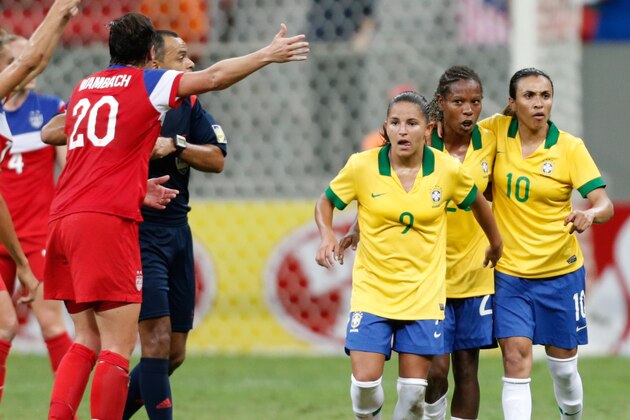 Brazil’s Marta Vieira, right, (10) celebrates with teammates Formiga, second right, (20) and Debora Cristiane, third right, (9) after scoring against the United States during a match of the International Women's Football Tournament at the National Stadium in Brasilia, Brazil, Sunday, Dec. 14, 2014. (AP Photo/Eraldo Peres)
