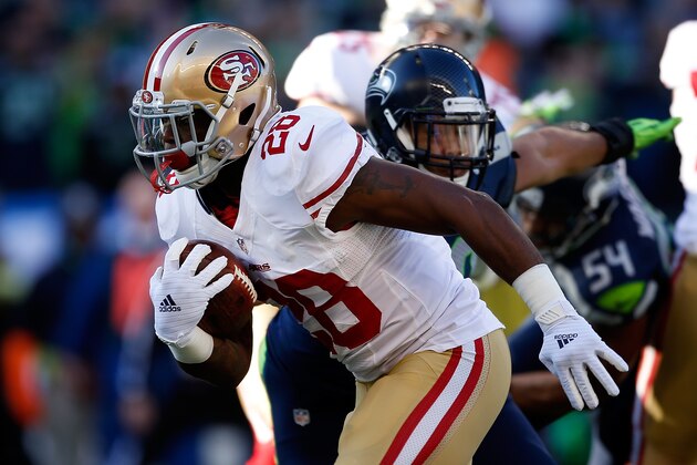 SEATTLE, WA - DECEMBER 14:  Running back Carlos Hyde #28 of the San Francisco 49ers runs with the ball during the first quarter of the game against the Seattle Seahawks at CenturyLink Field on December 14, 2014 in Seattle, Washington.  (Photo by Otto Greule Jr/Getty Images)
