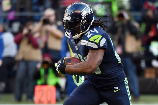 SEATTLE, WA - DECEMBER 14:  Running back Marshawn Lynch #24 of the Seattle Seahawks runs with the ball the first quarter of the game against the San Francisco 49ers at CenturyLink Field on December 14, 2014 in Seattle, Washington.  (Photo by Steve Dykes/Getty Images)