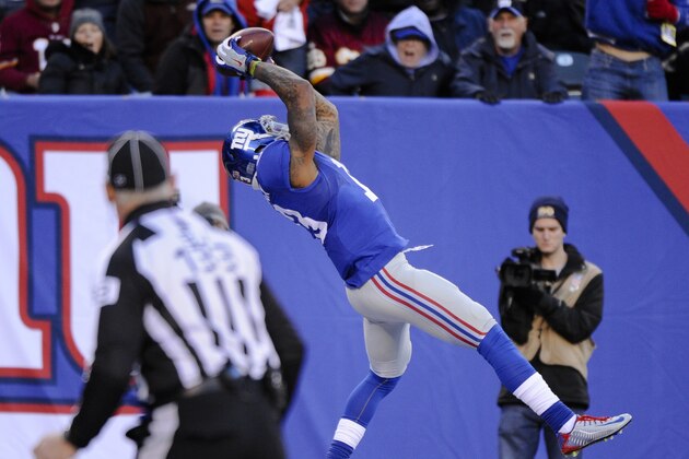 New York Giants wide receiver Odell Beckham Jr. (13) makes a catch in the end zone against the Washington Redskins during the fourth quarter of an NFL football game, Sunday, Dec. 14, 2014, in East Rutherford, N.J. A holding flag was called on the play against the Giants nullifying the touchdown.  (AP Photo/Bill Kostroun)