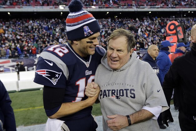 New England Patriots quarterback Tom Brady, left, celebrates with head coach Bill Belichick after defeating the Miami Dolphins 41-13 in an NFL football game Sunday, Dec. 14, 2014, in Foxborough, Mass. (AP Photo/Charles Krupa)