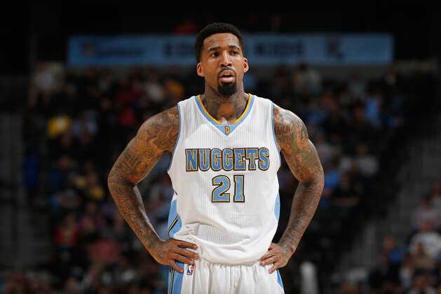 DENVER, CO - NOVEMBER 19:  Wilson Chandler #21 of the Denver Nuggets looks on against the Oklahoma City Thunder at Pepsi Center on November 19, 2014 in Denver, Colorado. The Nuggets defeated the Thunder 107-100. NOTE TO USER: User expressly acknowledges and agrees that, by downloading and or using this photograph, User is consenting to the terms and conditions of the Getty Images License Agreement.  (Photo by Doug Pensinger/Getty Images)