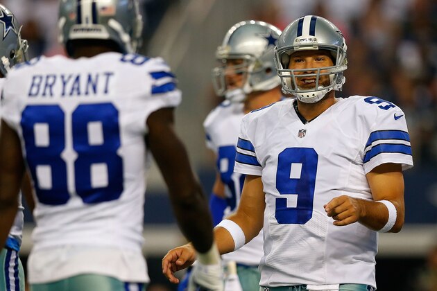 ARLINGTON, TX - AUGUST 16:  Tony Romo #9 of the Dallas Cowboys talks with Dez Bryant #88 of the Dallas Cowboys between plays against the Baltimore Ravens in the first half of their preseason game at AT&T Stadium on August 16, 2014 in Arlington, Texas.  (Photo by Tom Pennington/Getty Images)