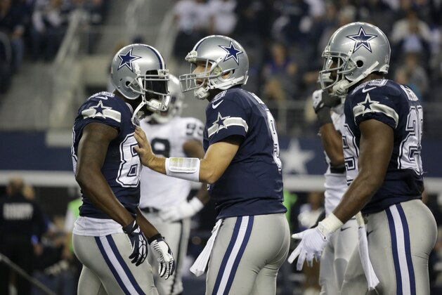 Dallas Cowboys wide receiver Dez Bryant (88), quarterback Tony Romo (9) and running back DeMarco Murray (29) get ready for a play during the second half of an NFL football game against the Oakland Raiders Thursday, Nov. 28, 2013, in Arlington, Texas.  (AP Photo/LM Otero)