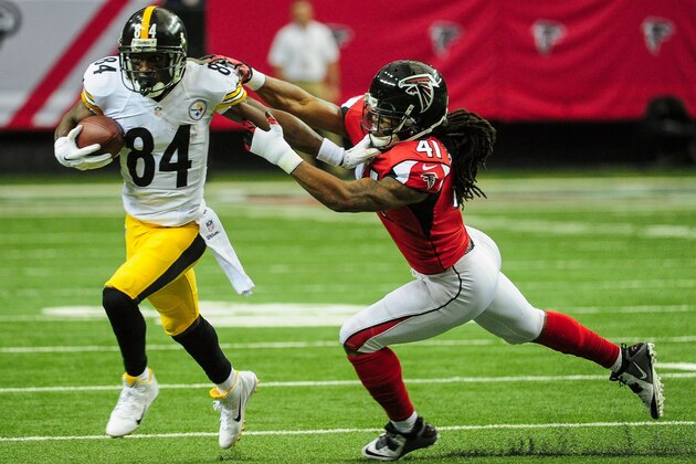 ATLANTA, GA - DECEMBER 14: Antonio Brown #84 of the Pittsburgh Steelers stiff arms Dezmen Southward #41 of the Atlanta Falcons after a catch in the first half at the Georgia Dome on December 14, 2014 in Atlanta, Georgia.  (Photo by Scott Cunningham/Getty Images)