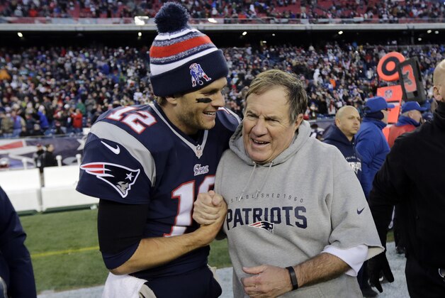 New England Patriots quarterback Tom Brady, left, celebrates with head coach Bill Belichick after defeating the Miami Dolphins 41-13 in an NFL football game Sunday, Dec. 14, 2014, in Foxborough, Mass. (AP Photo/Charles Krupa)