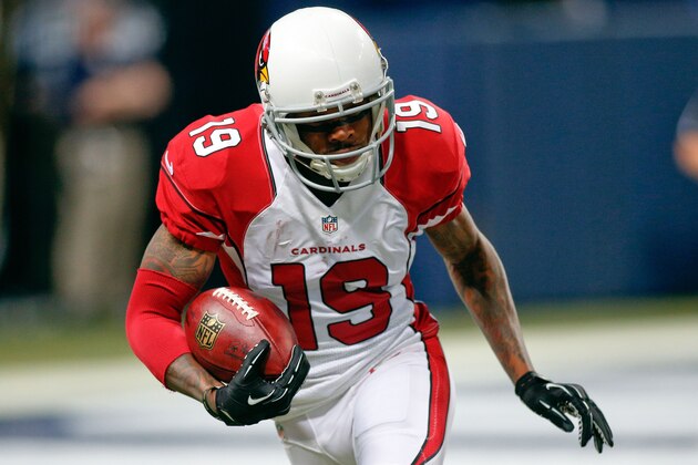 Dec 11, 2014; St. Louis, MO, USA; Arizona Cardinals wide receiver Ted Ginn (19) carries the ball during the first half of a football game against the St. Louis Rams at the Edward Jones Dome. Mandatory Credit: Scott Kane-USA TODAY Sports